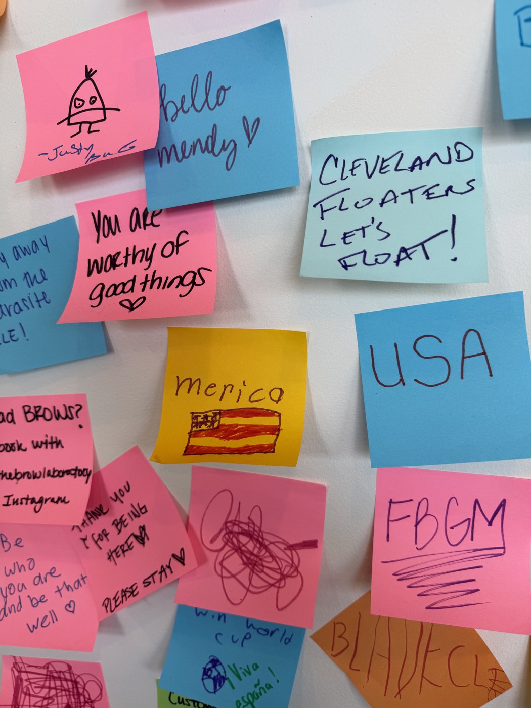 Stick Together CLE sticky note wall detail: Bad drawings encouraged.